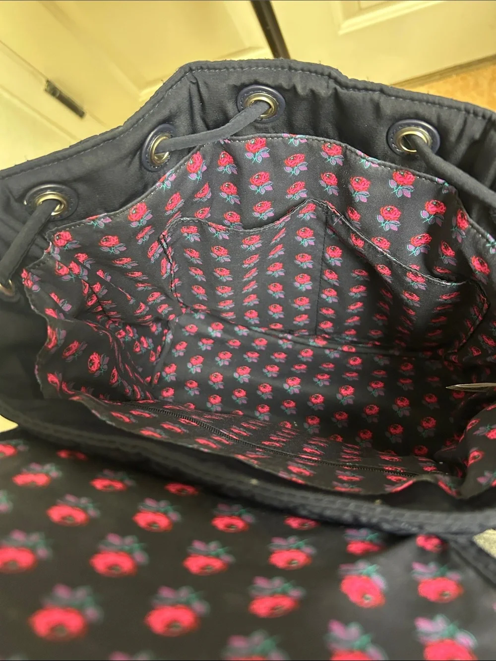 Vera Bradley quilted backpack in navy blue, diamond pattern a front flap closure